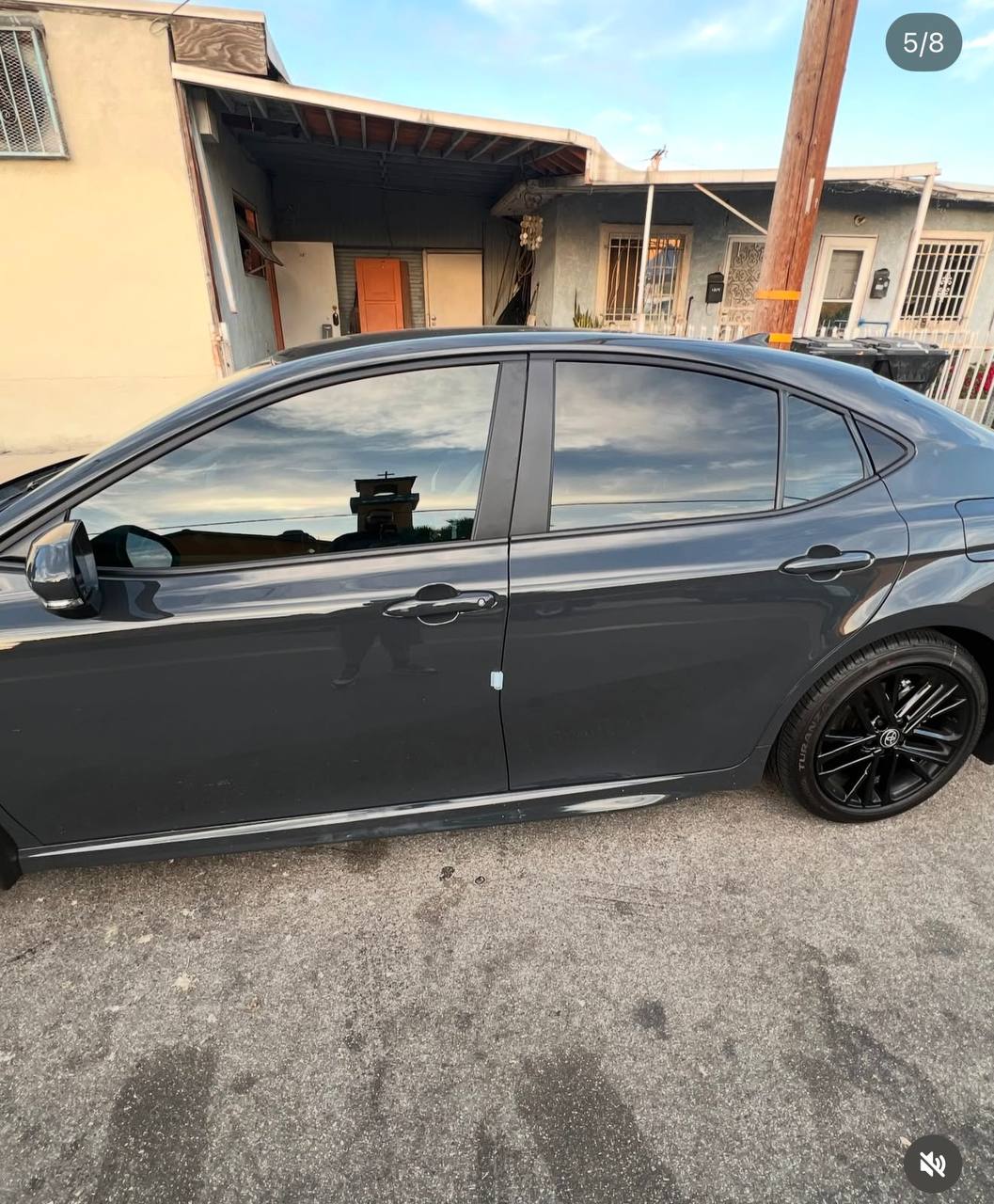 Gray Camry SE — rear angle golden hour